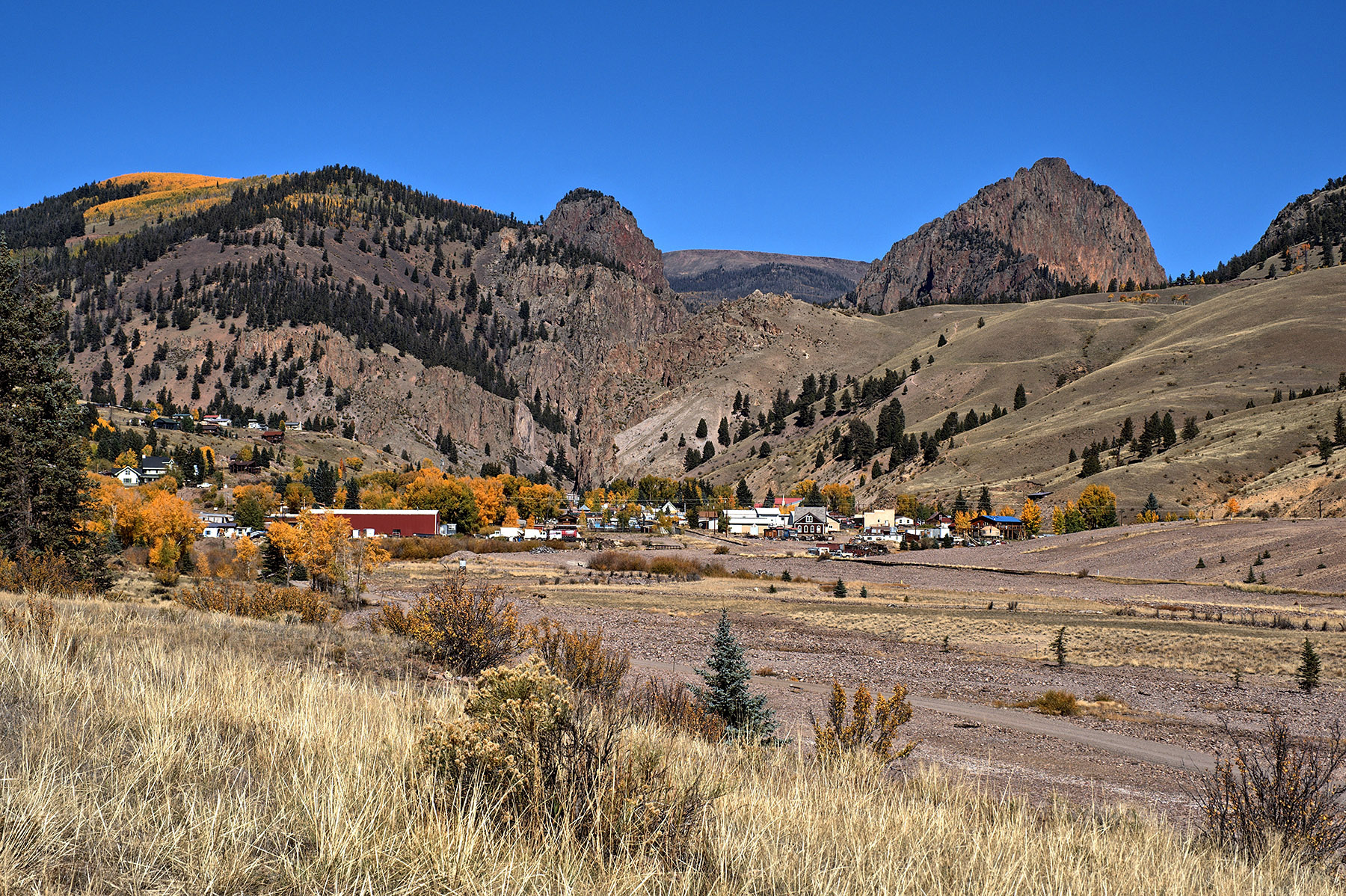 Creede, CO against the Creede caldera wall.  Heavy igneous infusion of metals along the caldera made this a very rich Silver mining center.  It is now a tourist center.