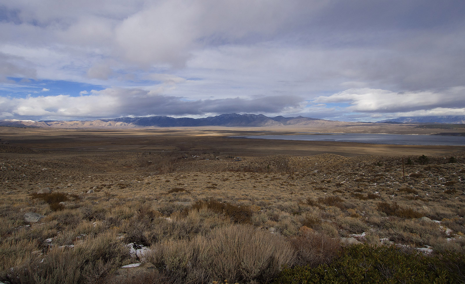 Long Valley Caldera:  This is the view from McGee Creek Road East over Crowley Lake and the filled in basin that was part of the Long Valley Caldera created by a violent volcanic explosion 760,000 years ago.   I'm standing near one edge of the caldera, and the volcanic ridges/peaks in the distant left mark a distant edge of the caldera.