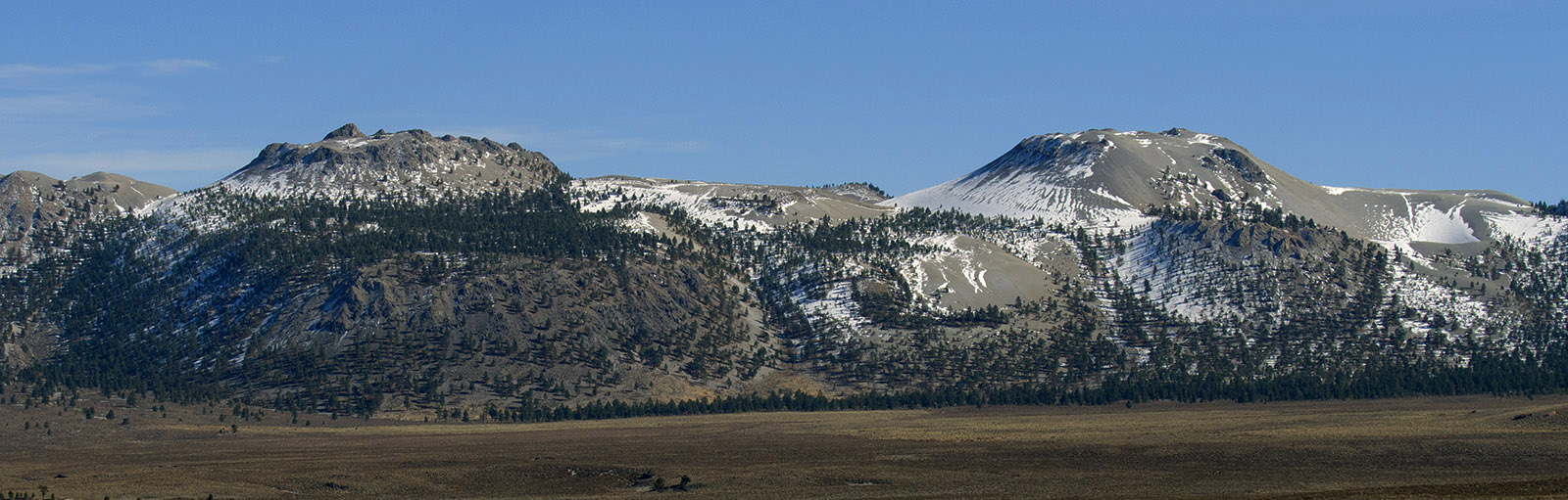 Crater Mountain (left) and South Coulee are two of the most striking rhyolitic volcanic peaks in the Mono Domes.  These are the first volcanoes I ever saw.  When I about 10 years old my family camped along Parker Creek in the June Lake area, and I have vivid memories of getting up at dawn and hiking to view these volcanoes and Mono Lake as the Sun rose.