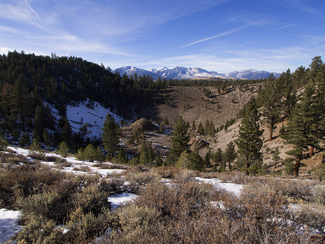 Devil's Punch Bowl in the Mono Dome area.  A small crater from explosive volcanic eruption with a glass dome in the center.  Carson peak is in the background.