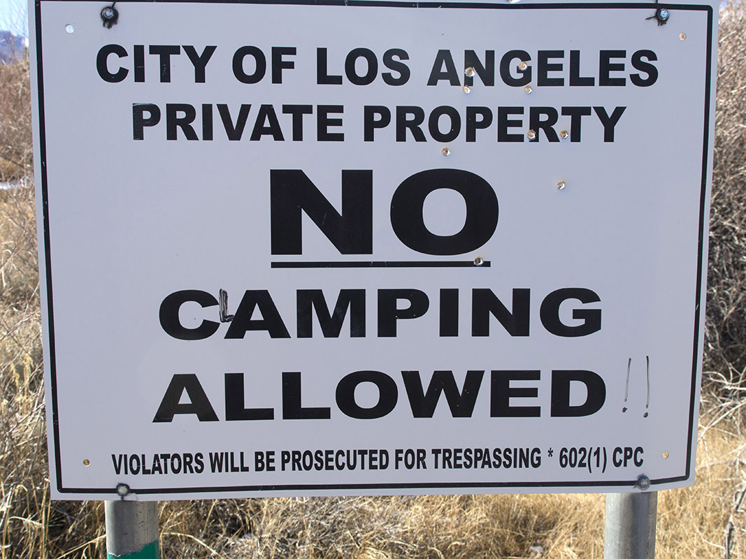 City of Los Angeles Sign at Parker Creek.   The City of Los Angeles bought land and water rights in the Owens Valley and around Mono Lake in the early 1900's and began diverting large quantities of water to Los Angeles after completion of the Los Angeles Aqueduct and diversion of Mono Basin Streams in 1942.  Note 9mm editorial comment in the sign intended to keep coliform content of the stream water at a low level.