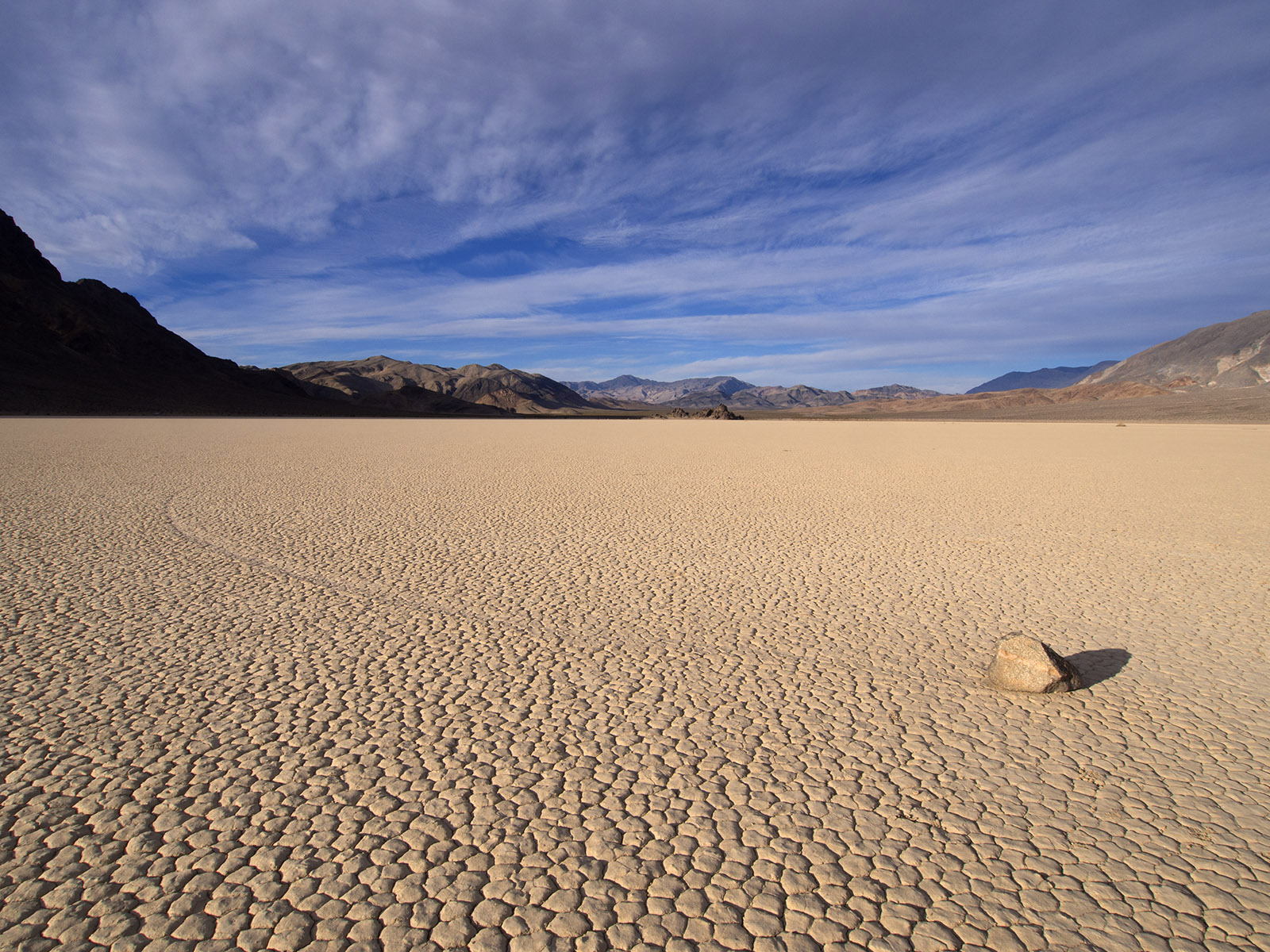 Sailing stone on Racetrack Playa.  The perfect combination of moisture, wind, and possibly, ice facilitate movement bursts of an estimated 3 mph of these rocks and leave a trail.
