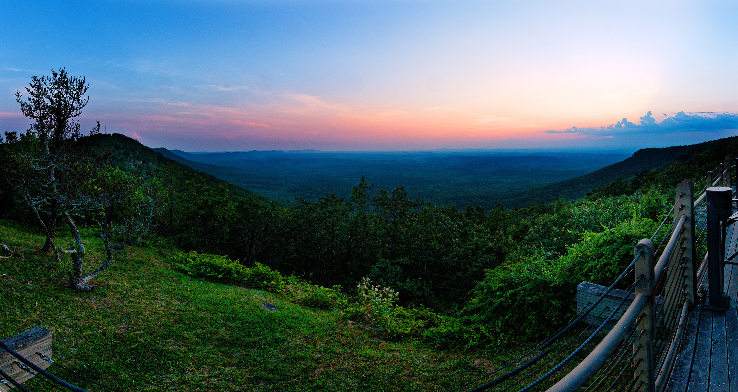 Sunset over Coosa River Valley from Cheaha Mountain.  Cheaha Mountain is the highest mountain in Alabama (2400 feet).  It is part of the Talledega mountains, and one of the southern-most mountains in the Appalachian Mountain range.  It is composed mostly of quartzite and metamorphosed sandstone.