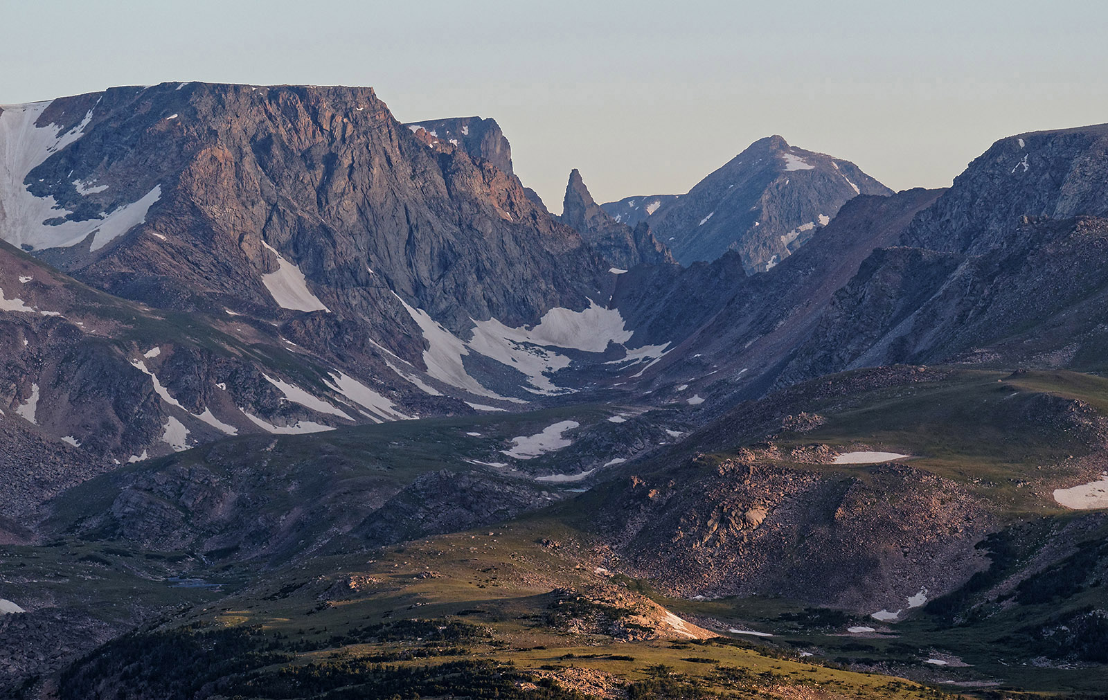 The beartooth was carved out of granitic gneiss by glacier activity.