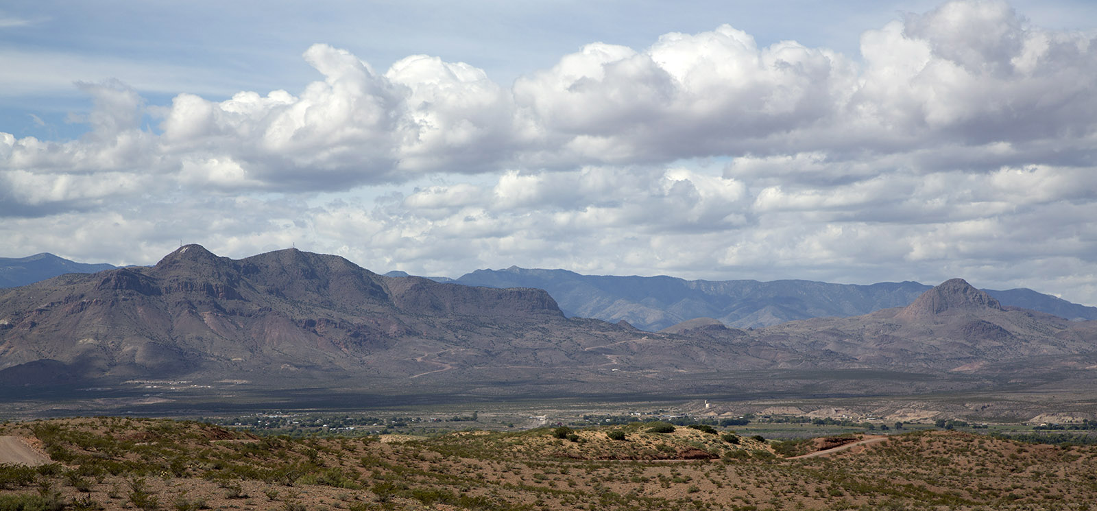 Quebradas National Back Country Byway above Socorro, NM.  Magdalena Mountains with Socorro Peak to the left and Strawberry Peak to the right are Paleozoic sedimentary layers with volcanic outcoups from 36 to 2.4 million years ago.