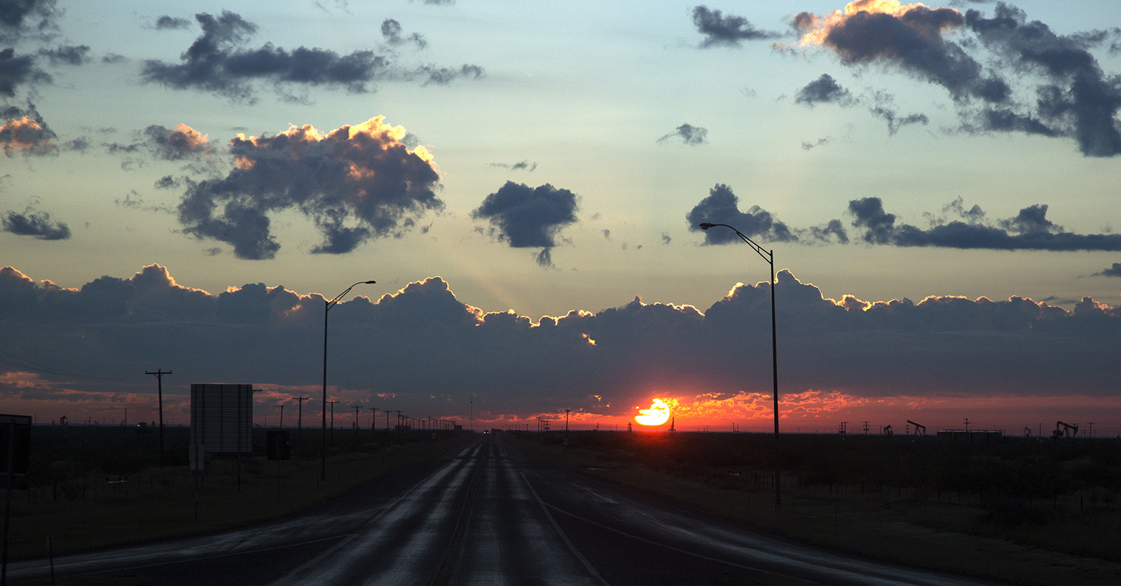 Midland Basin sunrise with oil pump jacks as I depart Texas for home.  Hydralic fracturing has brought boom times again to West Texas.